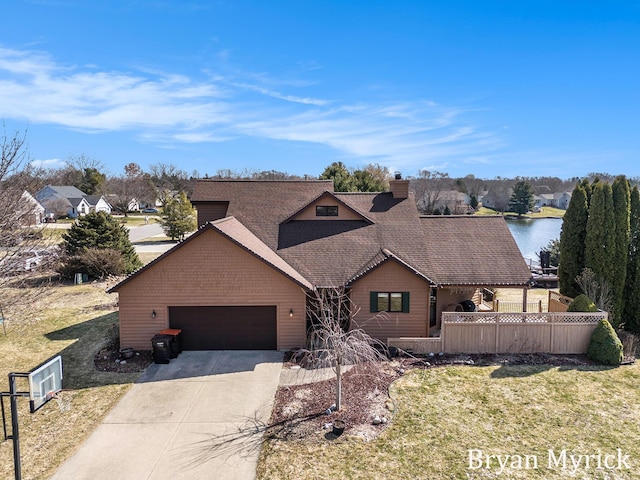 view of front of house with fence, driveway, a chimney, a shingled roof, and a garage