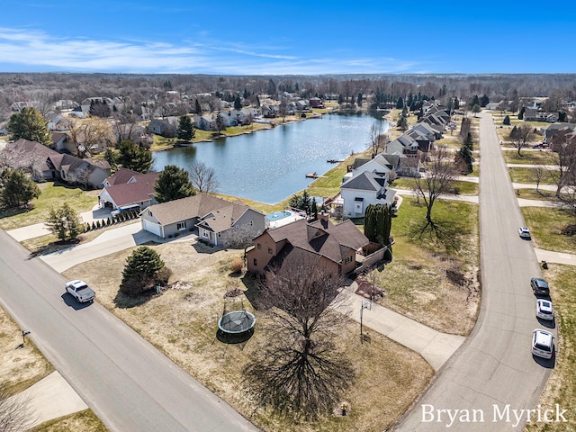 birds eye view of property featuring a residential view and a water view