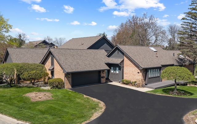 1920 Pine Ridge Ln, Bloomfield Hills, MI 48302 - view of front of home featuring brick siding, driveway, a garage, a shingled roof, and a front yard