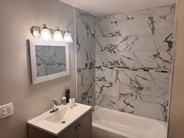 bathroom featuring shower / tub combination and vanity