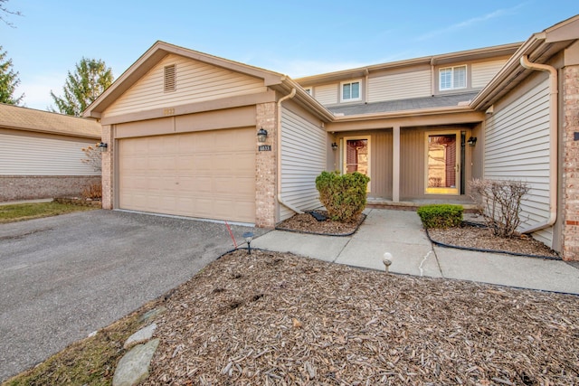 view of front of property featuring an attached garage and driveway