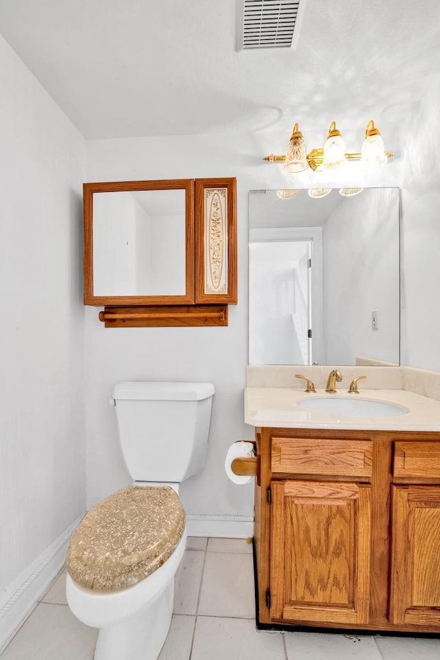 bathroom with tile patterned flooring, visible vents, baseboards, toilet, and vanity