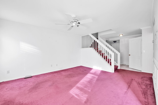 interior space featuring baseboards, stairway, a ceiling fan, and carpet