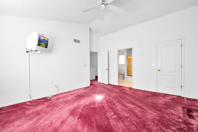 unfurnished bedroom featuring visible vents, connected bathroom, lofted ceiling, and carpet floors