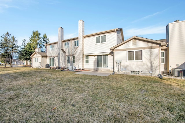 back of house featuring a yard, a patio, and central AC