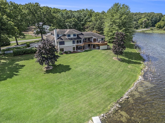 drone / aerial view with a water view