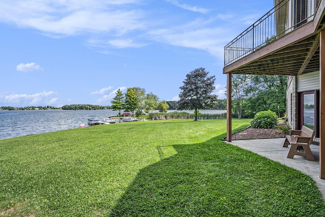 view of yard featuring a patio and a water view