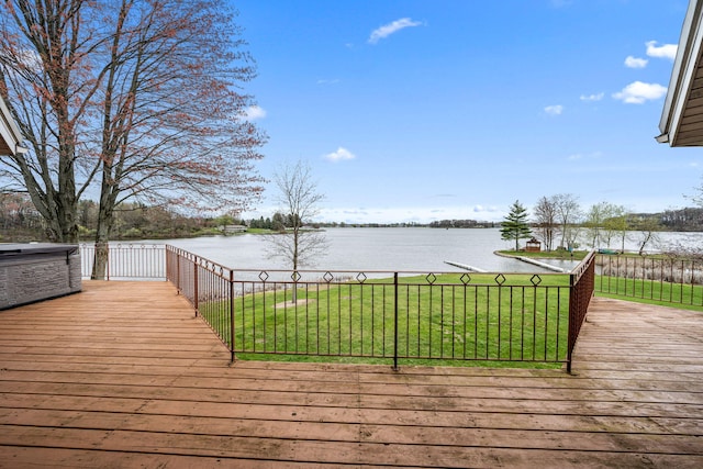 wooden deck featuring a yard and a water view