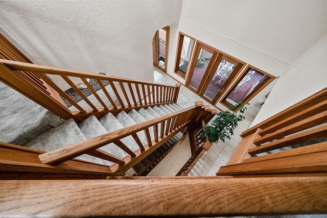 stairs featuring tile patterned floors