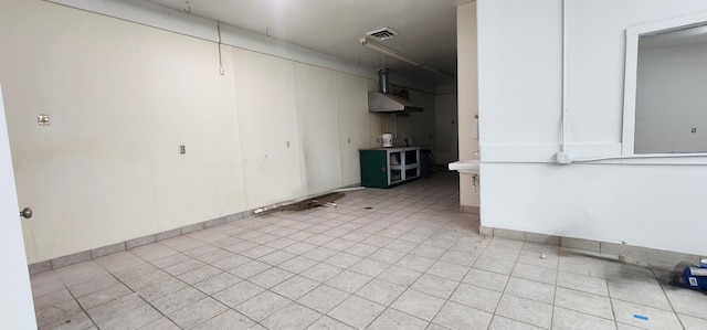 interior space with light tile patterned floors and visible vents