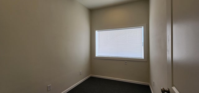 empty room featuring baseboards