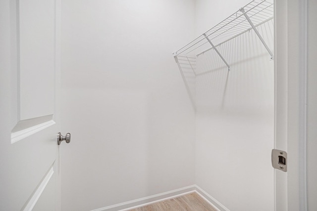 5227 Brinson Ln, Kalamazoo, MI 49009 - walk in closet with light wood finished floors