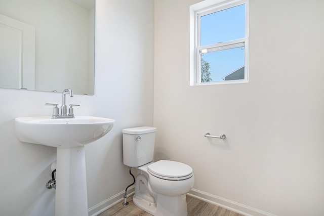 5227 Brinson Ln, Kalamazoo, MI 49009 - half bath featuring baseboards and wood finished floors