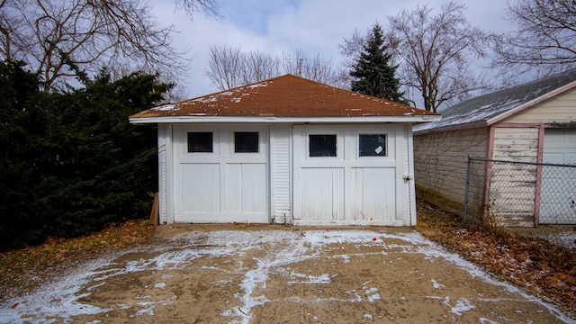 view of outbuilding featuring an outbuilding and fence