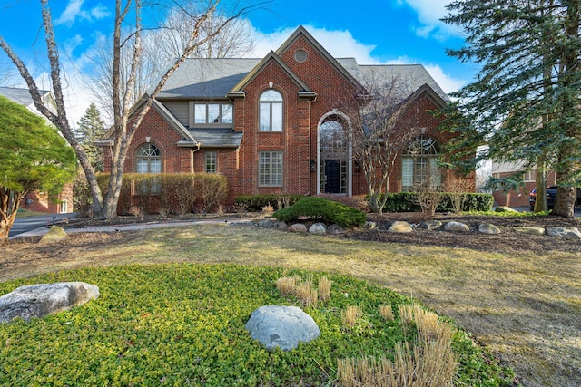 6264 Wildwood Ln, West Bloomfield, MI 48324 - traditional-style home featuring brick siding and a front lawn