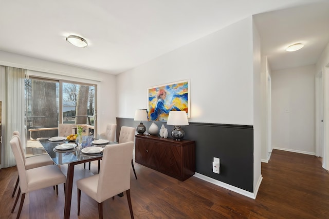 dining space with wood finished floors and baseboards