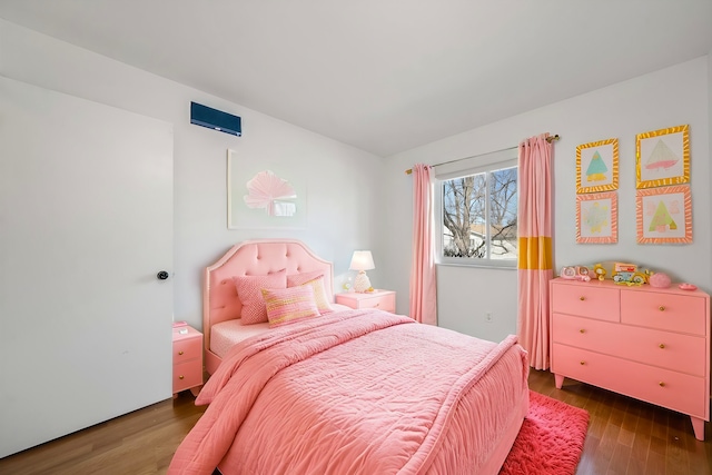 bedroom with wood finished floors