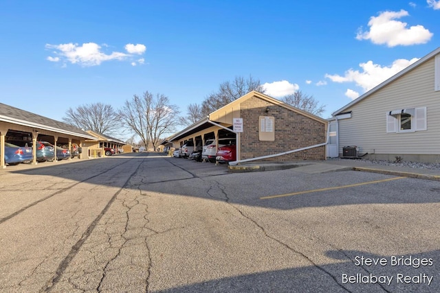 view of partially covered parking lot