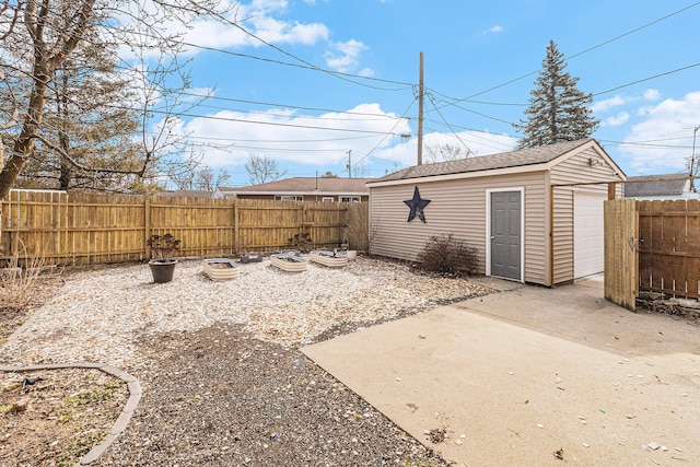 view of yard featuring a fenced backyard and an outdoor structure