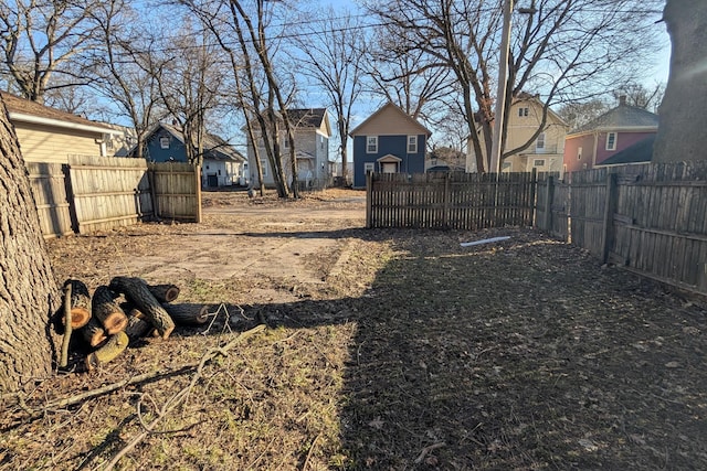 view of yard featuring a residential view and fence private yard