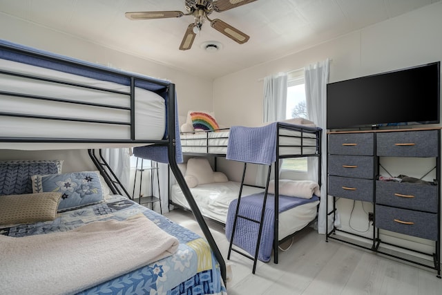 bedroom with ceiling fan and wood finished floors