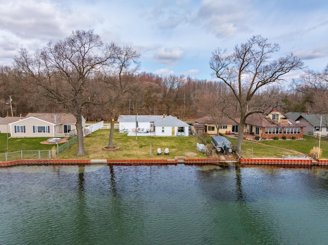 view of water feature featuring a residential view and fence