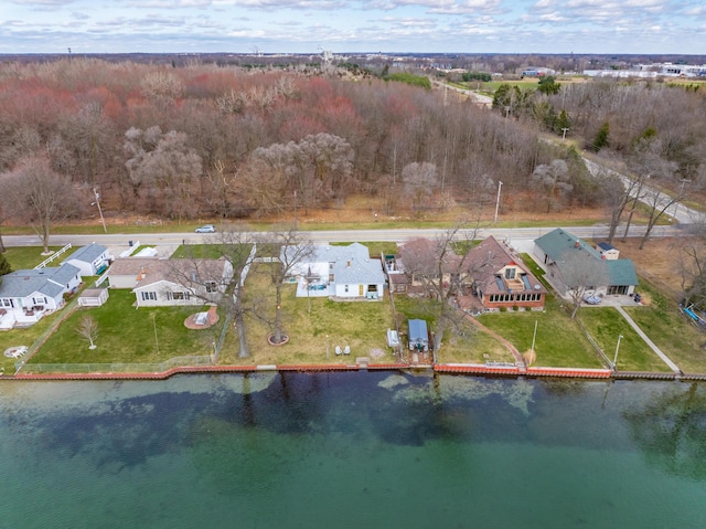 drone / aerial view featuring a residential view and a water view