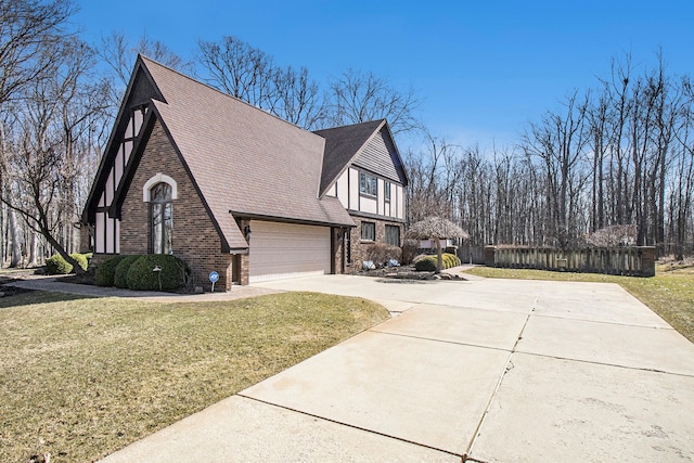 view of property exterior featuring concrete driveway, a yard, and brick siding