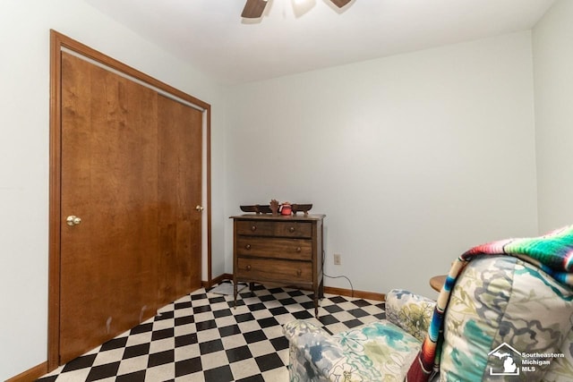 bedroom featuring tile patterned floors, ceiling fan, a closet, and baseboards