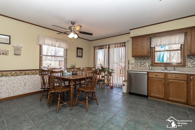 dining space with a wealth of natural light, ceiling fan, and crown molding