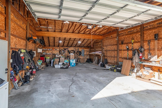 garage featuring a workshop area and a garage door opener