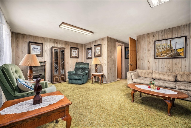 carpeted living area with wooden walls