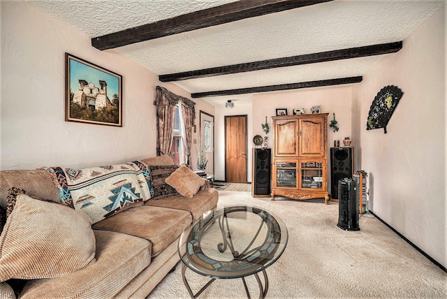 living room featuring beamed ceiling, carpet flooring, a textured wall, and a textured ceiling