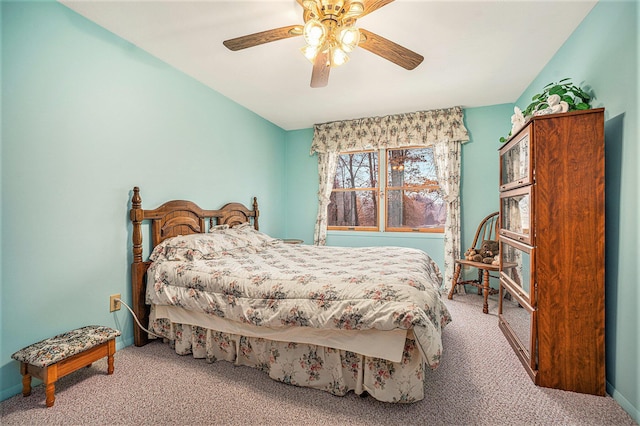 carpeted bedroom featuring baseboards and ceiling fan