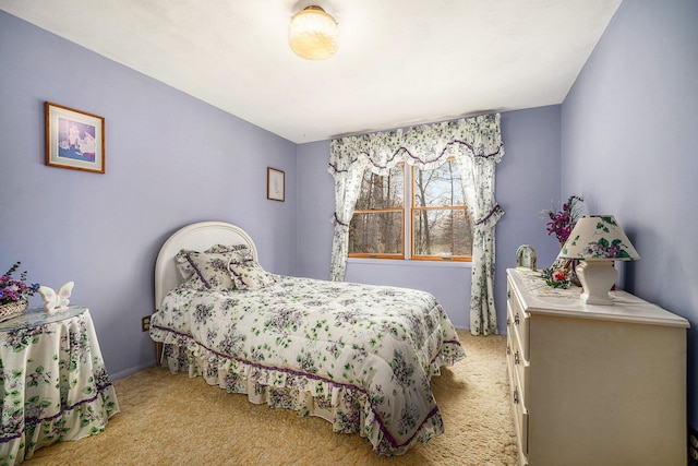 bedroom with light colored carpet