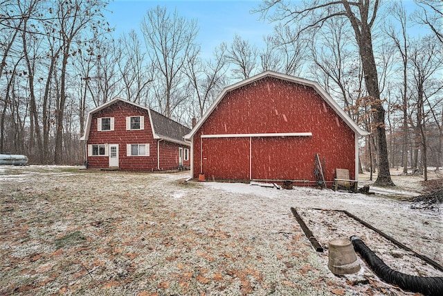 exterior space featuring a barn, a garage, a gambrel roof, and an outdoor structure