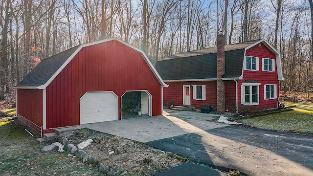 exterior space featuring concrete driveway