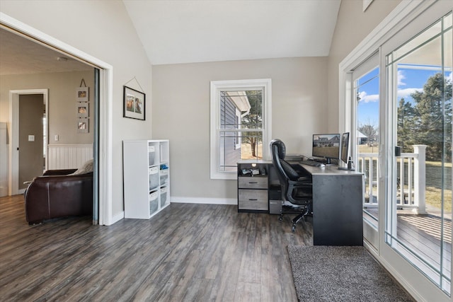 office with lofted ceiling, dark wood-style flooring, and wainscoting