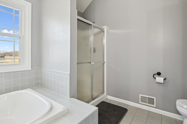 full bathroom with tile patterned floors, visible vents, baseboards, and a shower stall