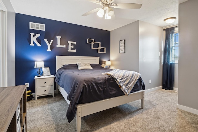 bedroom featuring a ceiling fan, carpet flooring, baseboards, and visible vents