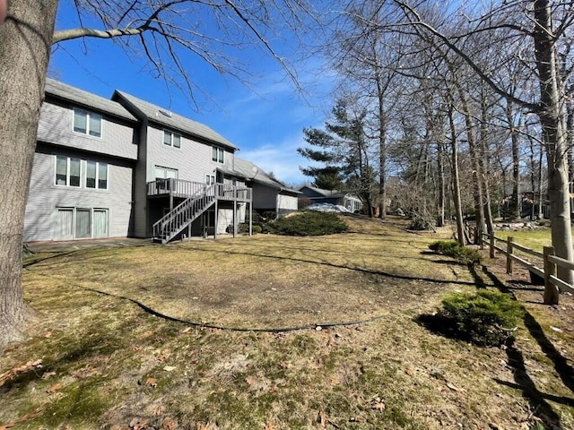 view of yard featuring stairway and a deck