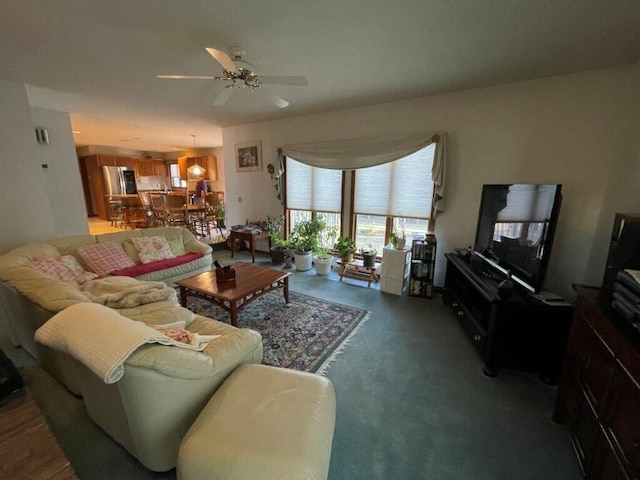 living area featuring a ceiling fan