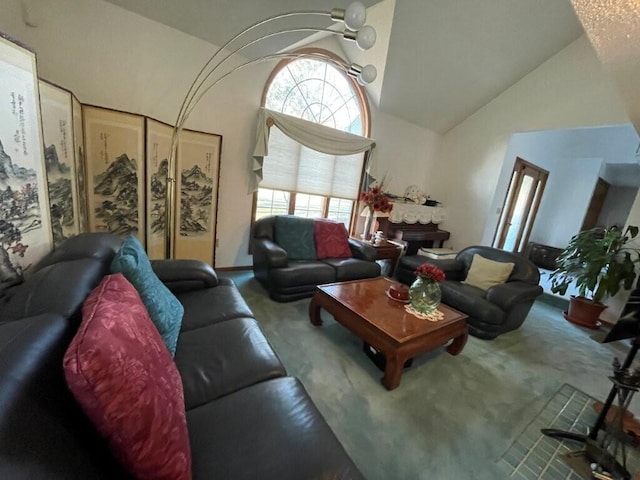 living room featuring carpet and high vaulted ceiling