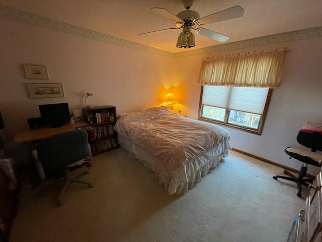 bedroom featuring a ceiling fan, carpet, and baseboards