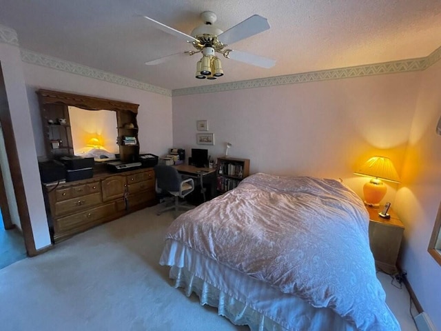 bedroom featuring baseboards, carpet, a ceiling fan, and a textured ceiling