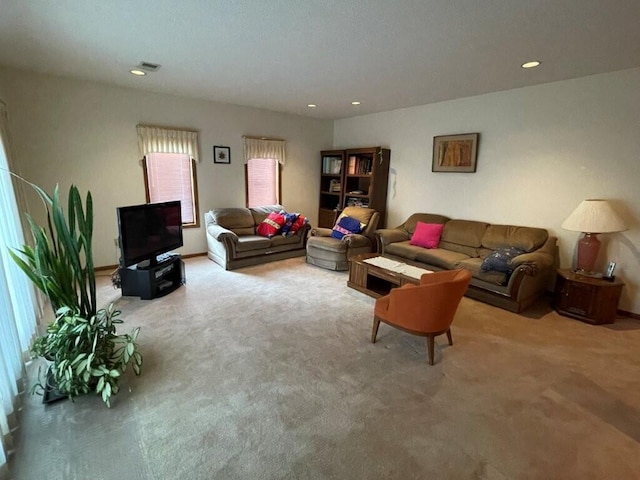 living area with carpet flooring, recessed lighting, and visible vents