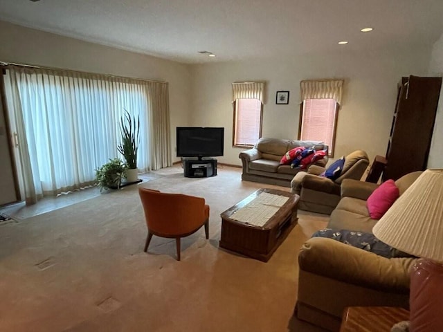 carpeted living area featuring recessed lighting