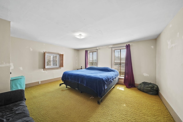 bedroom featuring carpet flooring and baseboards