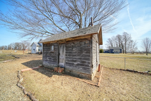 view of shed with fence