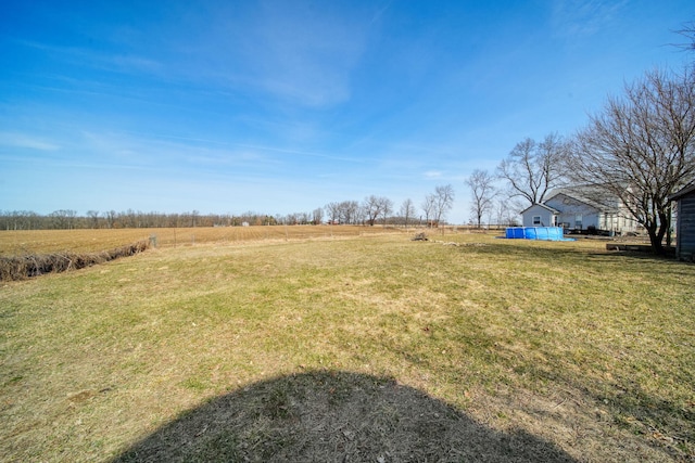 view of yard with a rural view